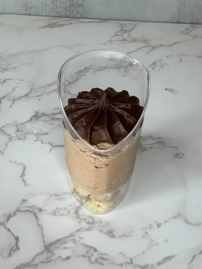 Individual chocolate mousse cup with chocolate rosette