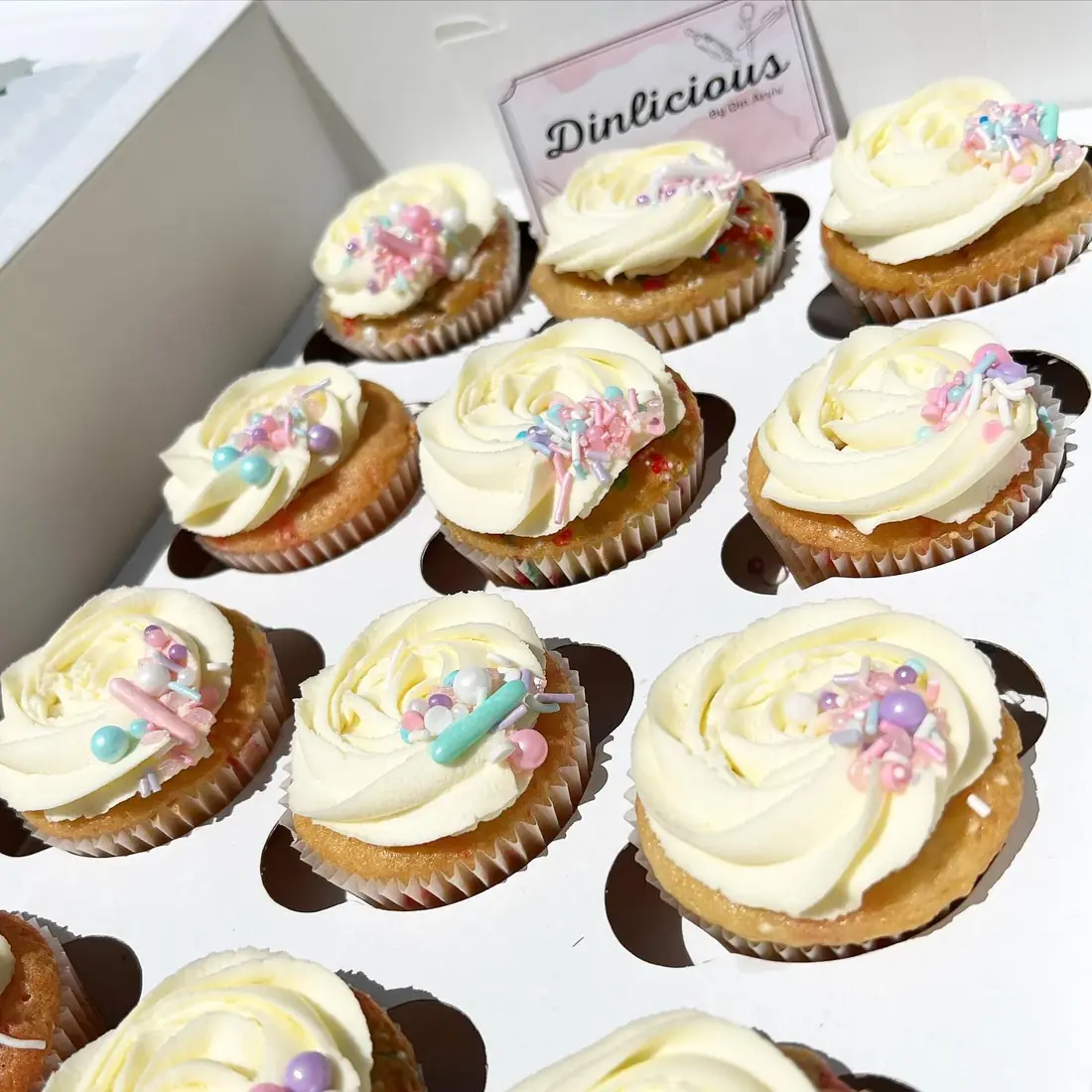 Vanilla cupcakes with pastel buttercream flowers