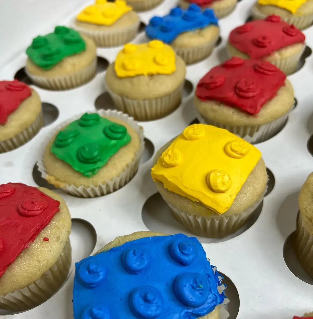 Lego brick themed cupcakes in primary colors