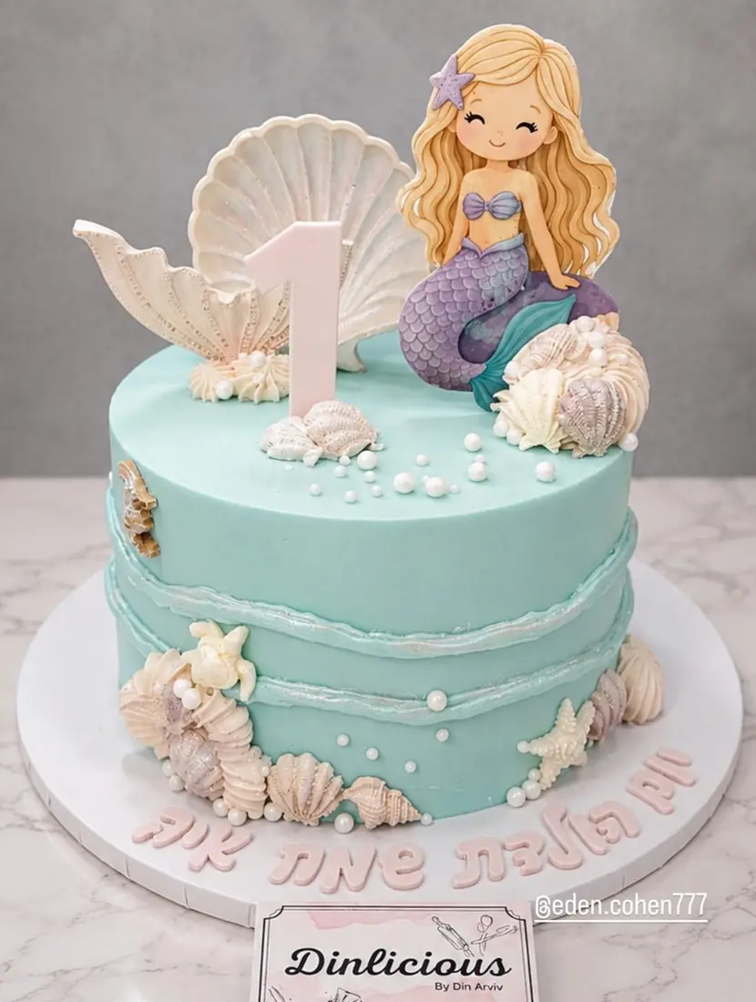 Mermaid themed teal cake with seashells by Cakes by Din
