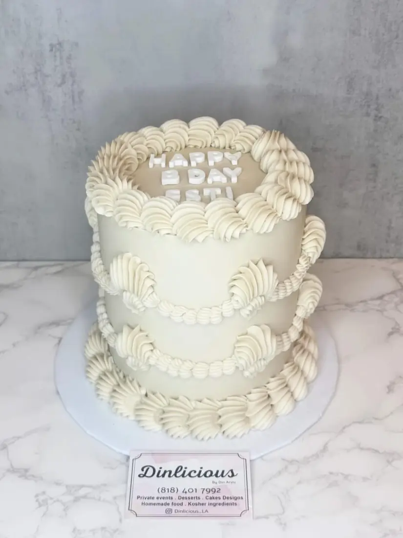 White vintage piped buttercream cake by Cakes by Din