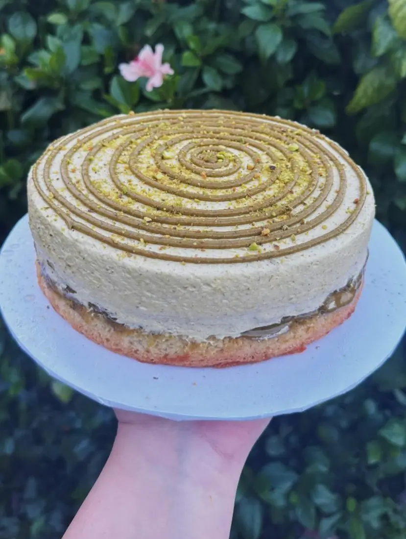Pistachio mousse cake with swirled pistachio cream top