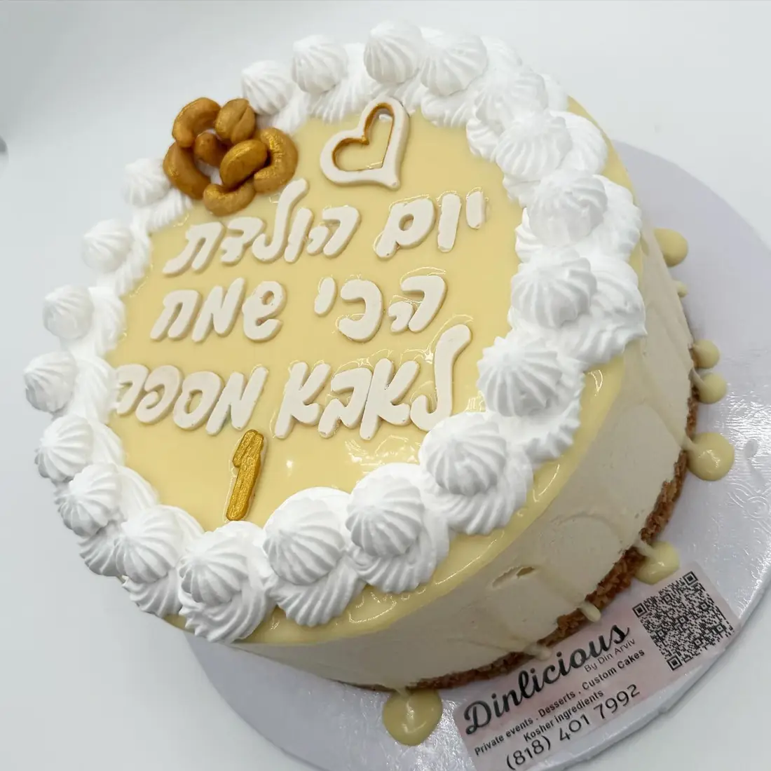 Signature cashew and white chocolate mousse cake with piped cream border