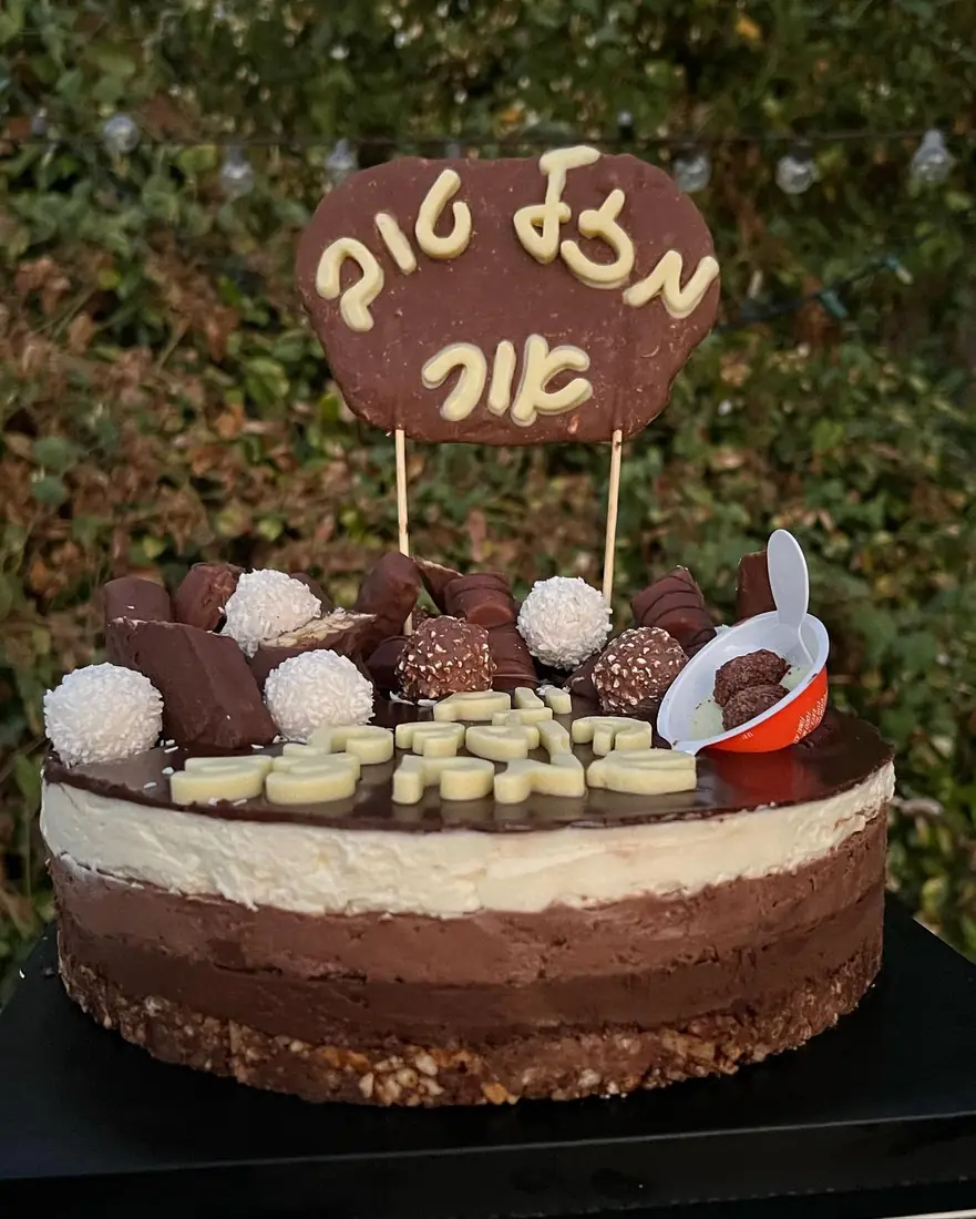 Tricolor chocolate mousse cake on a butter cookie base